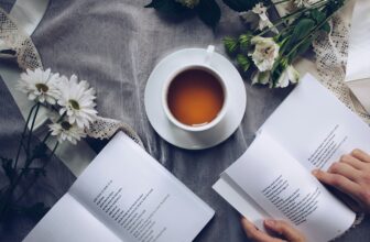 Warm bedside lamp and open book — evening wind-down routine for recovery