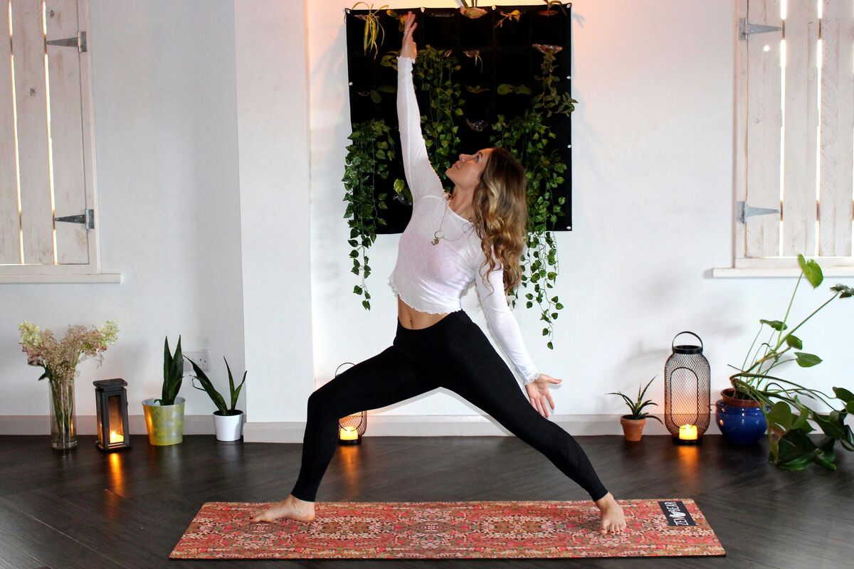 Evening stretching routine by candlelight
